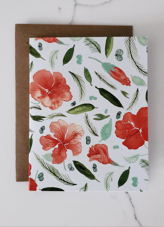 Floral patterned card with red flowers and green leaves on a white background
