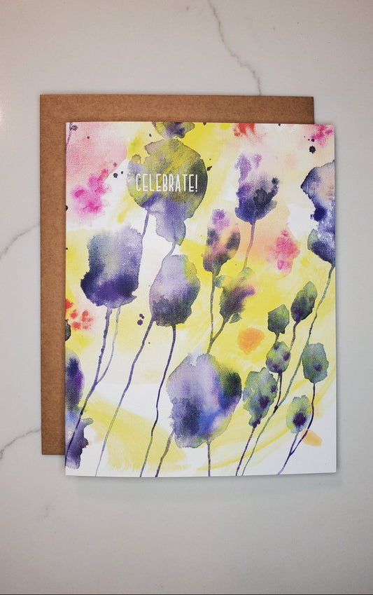 Greeting card with watercolor floral design on a white surface