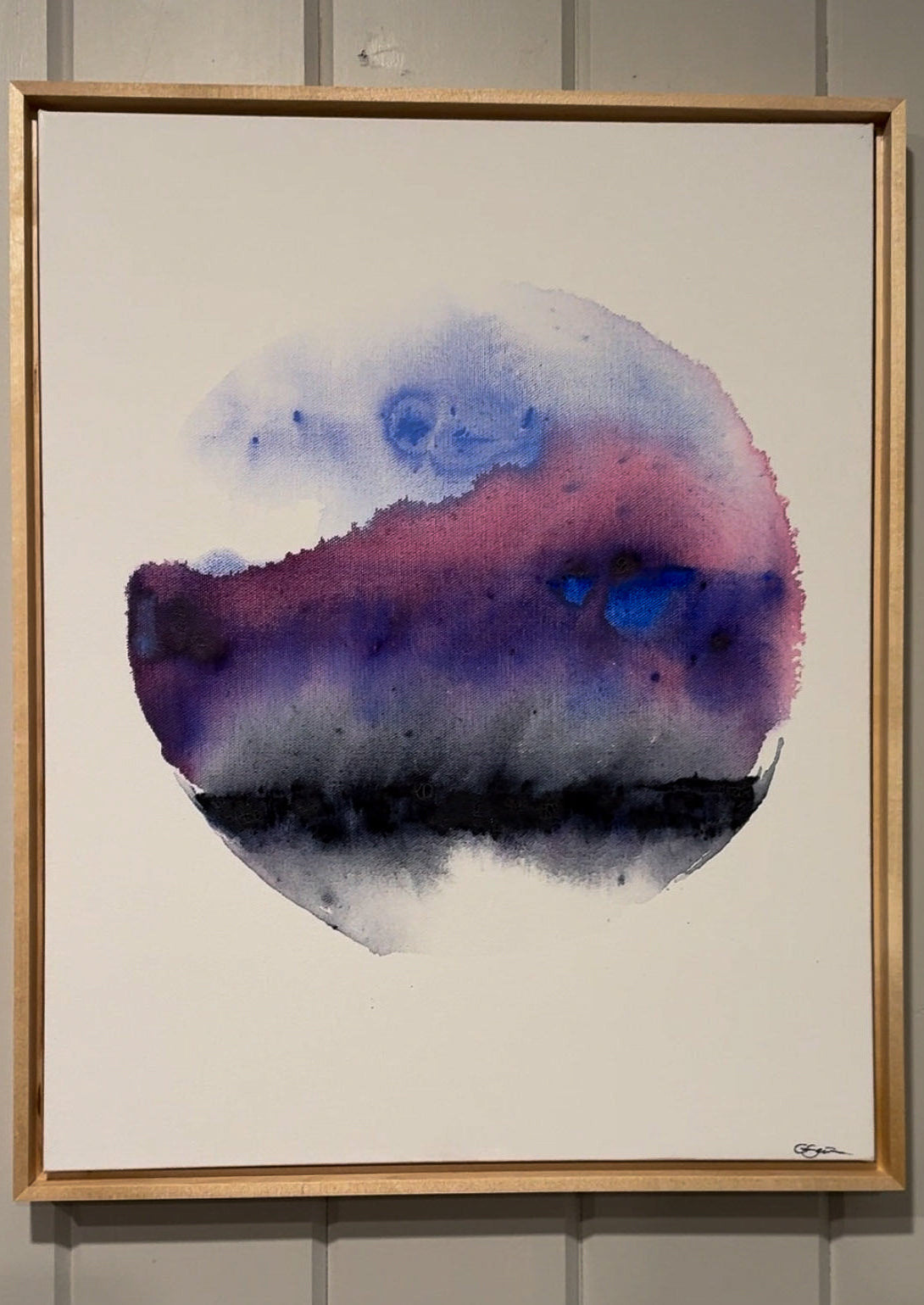 Framed abstract watercolor painting with a gradient of blue, pink, and purple on a white background.