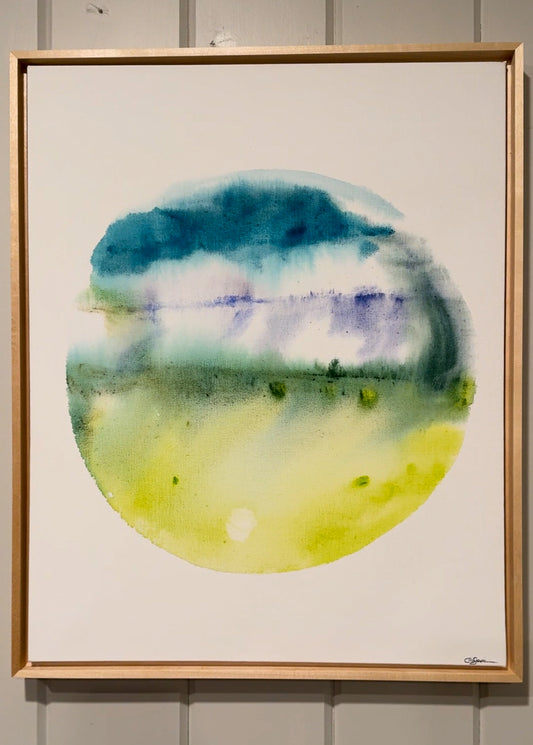 Framed watercolor painting with circular design in blue, green, and purple on a white background.