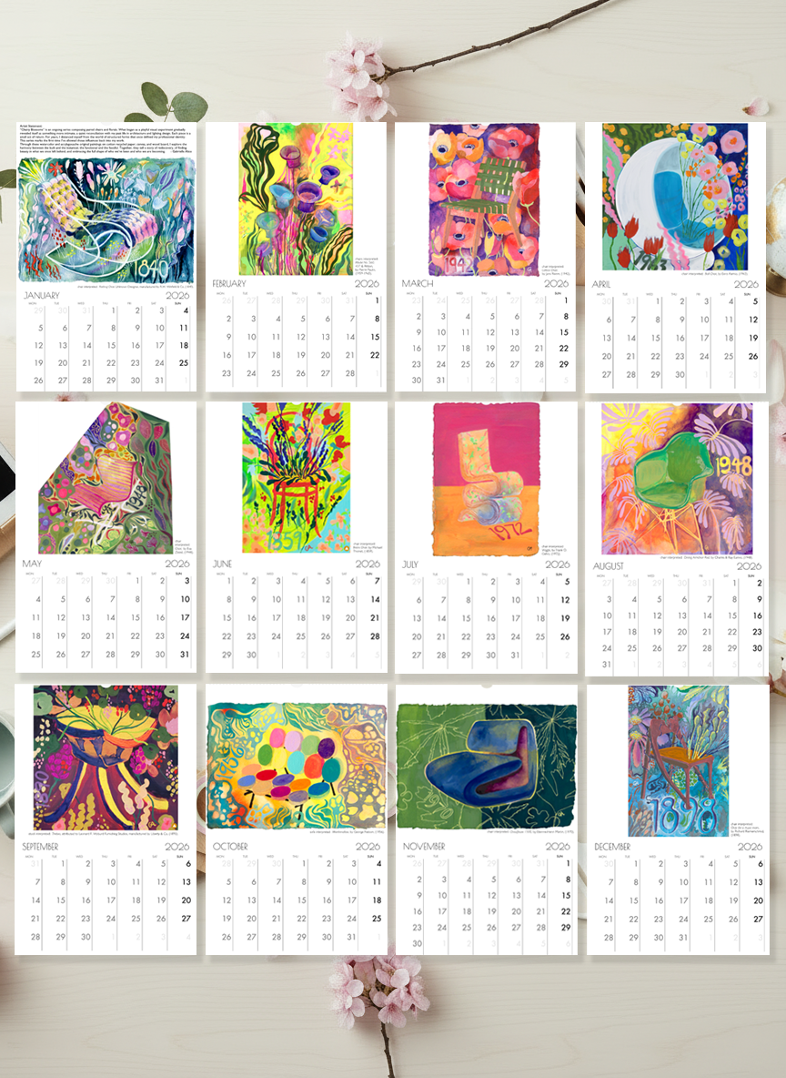 Colorful calendar with artistic designs on a white wall.