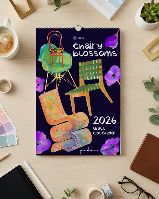 2026 wall calendar titled 'Chairy Blossoms' on a desk with office supplies.
