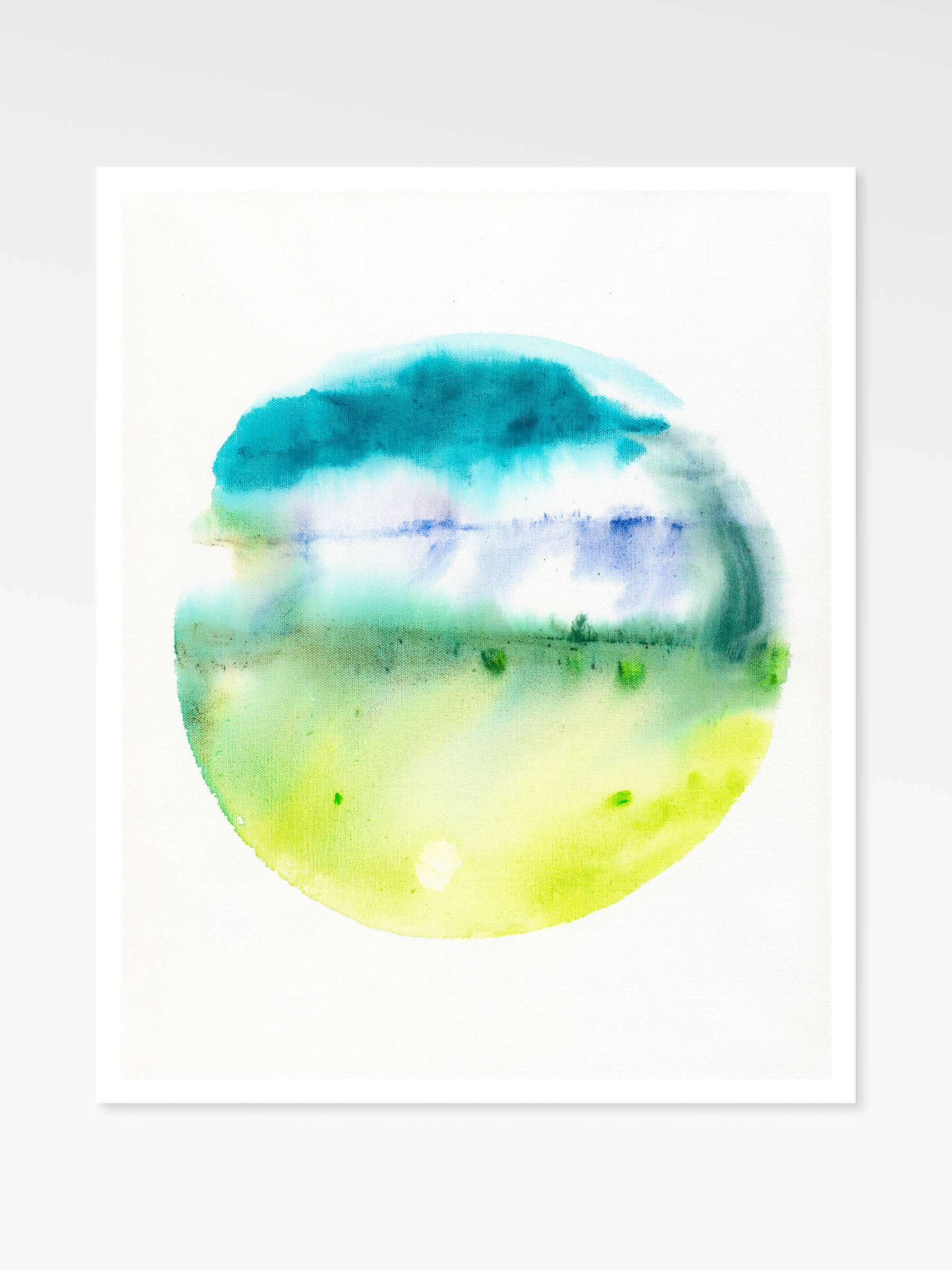 Colorful abstract circular design with blue and green hues on a white background
